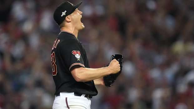 Diamondbacks closer Paul Sewald celebrates after recording the final out of Game 4 of the NLCS.